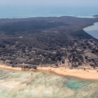 Heavy ash fall over Nomuka in Tonga on Monday | NEW ZEALAND DEFENSE FORCE / VIA REUTERS
