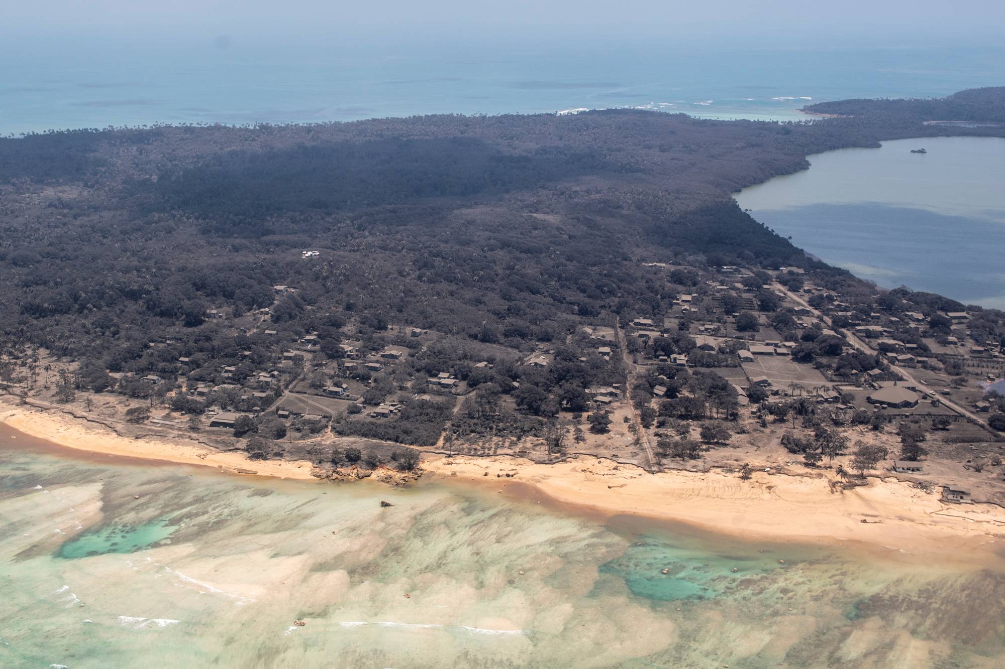 Heavy ash fall over Nomuka in Tonga on Monday | New Zealand Defense Force / via Reuters 