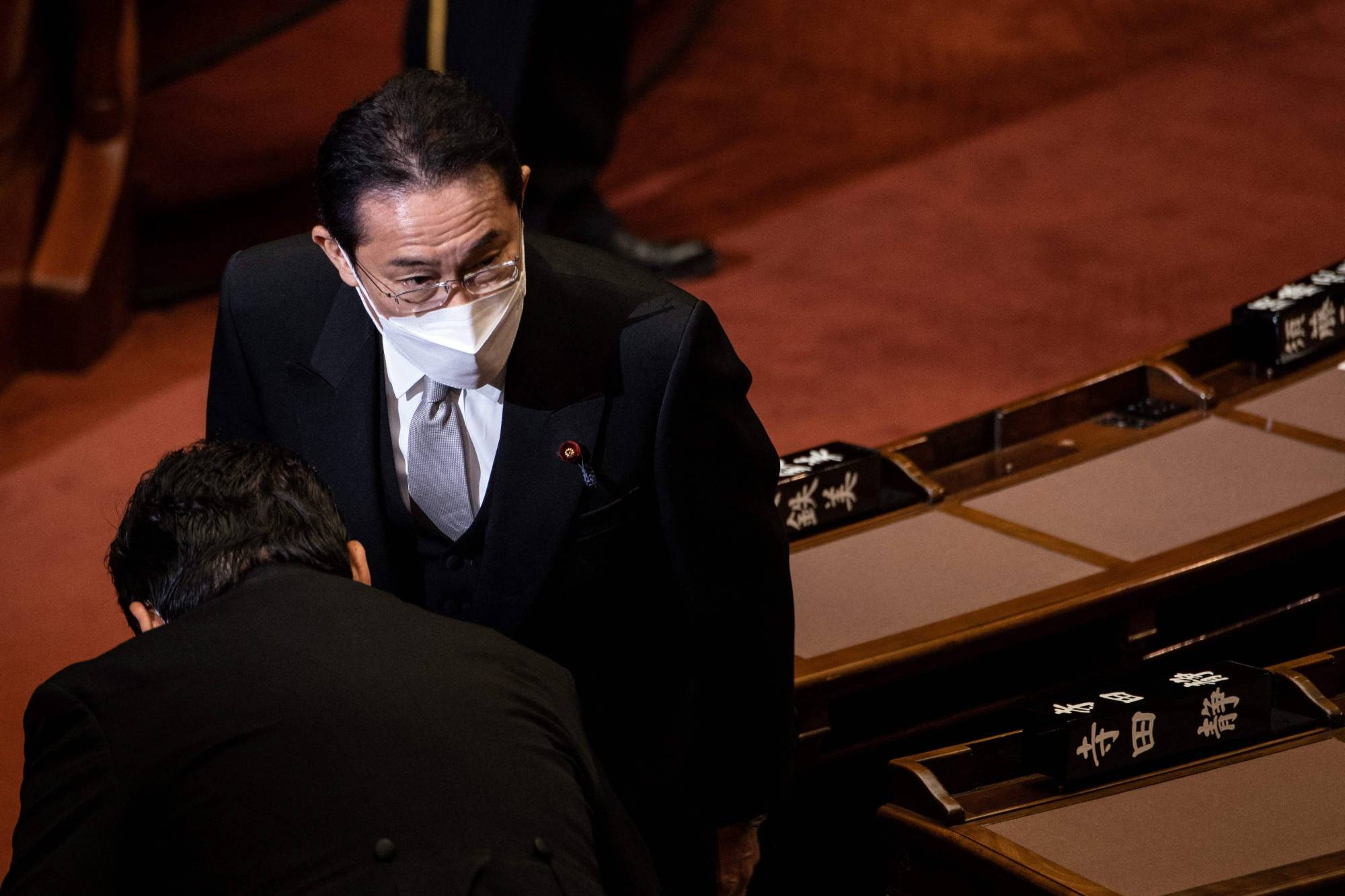 Prime Minister Fumio Kishida greets lawmakers during the opening ceremony of a regular session of the Upper House of parliament in Tokyo on Monday. | AFP-JIJI