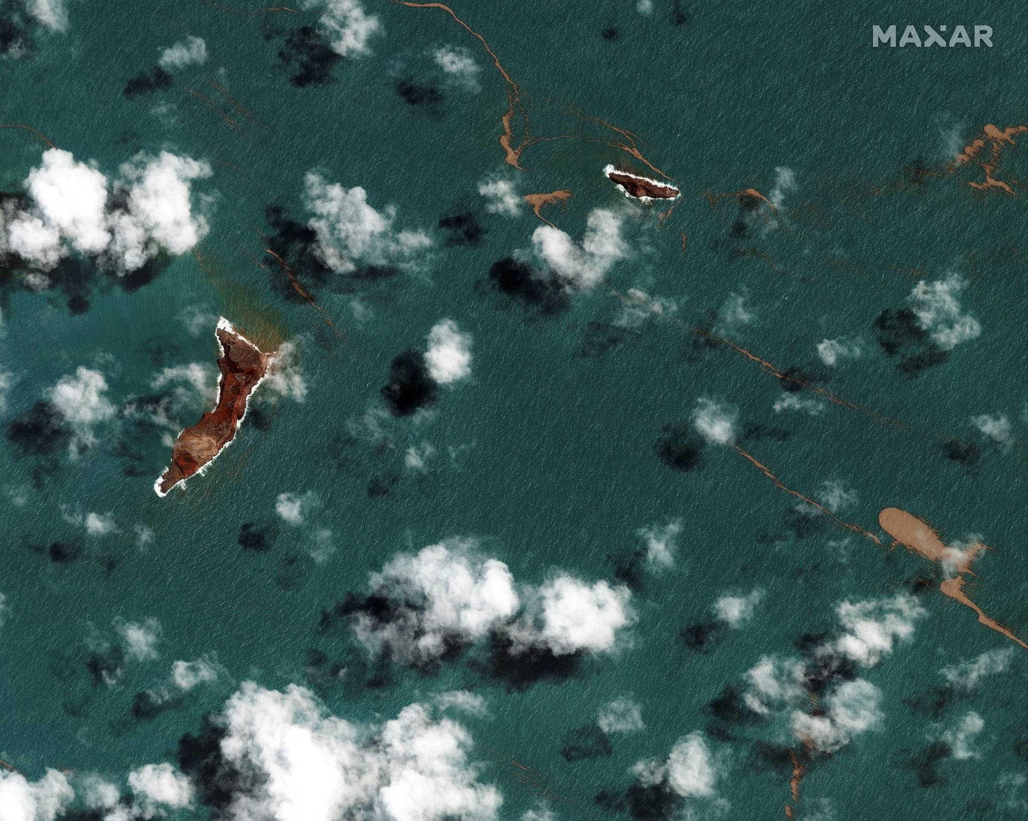 A satellite image shows the Hunga Tonga-Hunga Ha'apai volcano after its main eruption, in Hunga-Tonga-Hunga-Ha'apai, Tonga, Tuesday. | 2022 MAXAR TECHNOLOGIES / VIA REUTERS