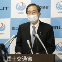 Land minister Tetsuo Saito speaks at a news conference at the ministry Friday. | KYODO