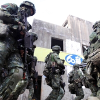Taiwanese soldiers participate in a military exercise simulating an invasion by China, in Kaohsiung, Taiwan, on Jan. 6. | BLOOMBERG