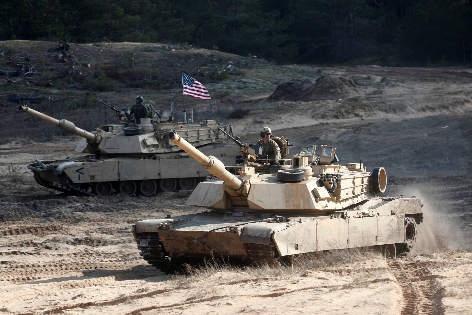 U.S. Army M1A1 Abrams tanks take part in a  NATO enhanced Forward Presence battle group military exercise in Adazi, Latvia, last March. | REUTERS