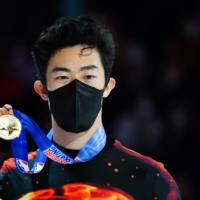 Nathan Chen poses with the gold medal after winning the U.S. Figure Skating Championships in Nashville on Jan. 9. | USA TODAY / VIA REUTERS