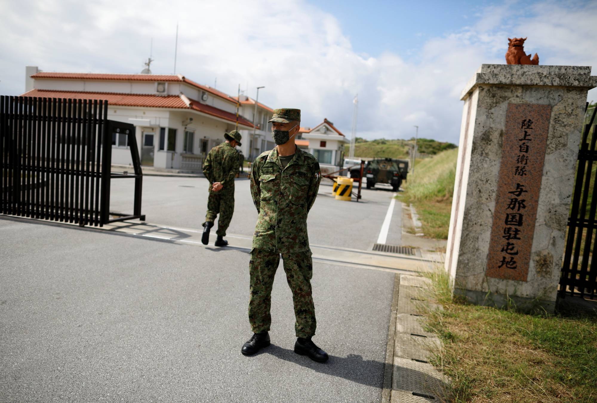 Ground Self-Defense Force soldiers stand guard at the entrance gate of their base in Yonaguni Island, the country's westernmost inhabited islet, in Okinawa Prefecture, last October. | REUTERS