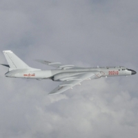 A Chinese H-6 bomber flies over the East China Sea in a photo released in July 2019. On Sunday, China sent its largest number of warplanes into Taiwan’s air defense identification zone since October. | JOINT STAFF OFFICE OF THE JAPANESE DEFENSE MINISTRY / VIA REUTERS