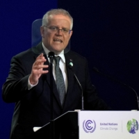 Australia\'s Prime Minister Scott Morrison speaking at the U.N. Climate Change Conference (COP26) in Glasgow in Nov. 2021. | REUTERS
