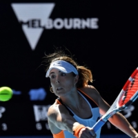 Alize Cornet hits a return against Simona Halep during their match in the fourth round of the Australian Open in Melbourne on Monday. | AFP-JIJI