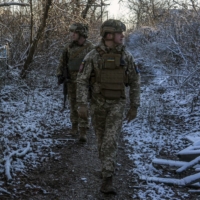 Ukrainian soldiers in Avdiivka, Ukraine, on Dec. 2. Russia has engaged in a troop buildup near Ukraine and is calling for a Russian zone of influence free of NATO and Western involvement. | BRENDAN HOFFMAN / THE NEW YORK TIMES
