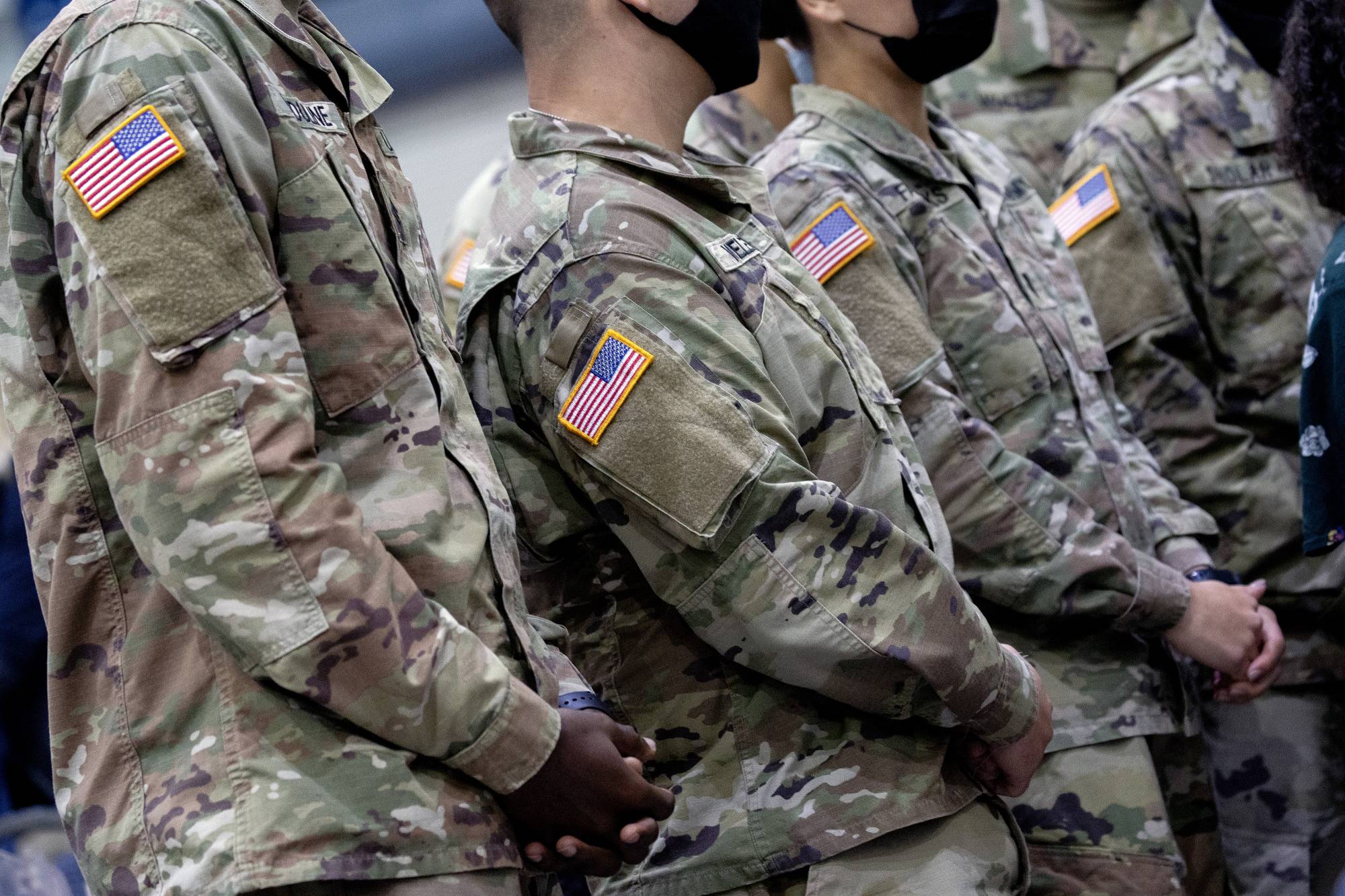 Soldiers wait to greet U.S. President Joe Biden at Fort Bragg in North Carolina on Nov. 22. Defense Secretary Lloyd Austin has put 8,500 American troops on high alert for possible deployment to Eastern Europe. | Stefani Reynolds / The New York Times