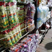 Several flavors of Umaibo, a popular Japanese corn-based snack, at a confectionery wholesaler\'s in Tokyo on Tuesday. | REUTERS