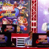 Visitors play video games at Capcom\'s booth at Tokyo Game Show in Chiba Prefecture in 2017.  | REUTERS