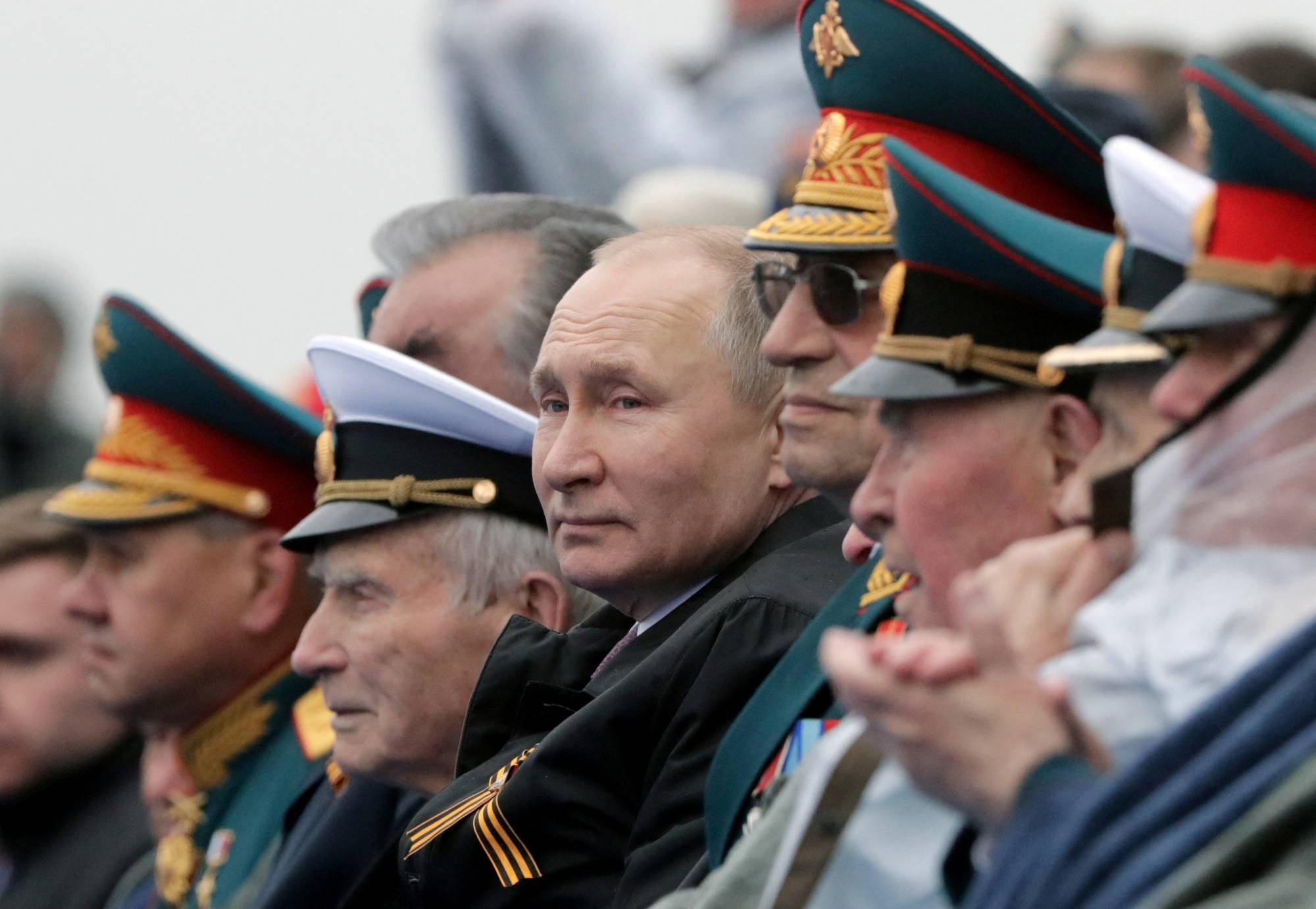 Russian President Vladimir Putin attends a military parade in Red Square in central Moscow in May last year.  | SPUTNIK / POOL / VIA REUTERS 