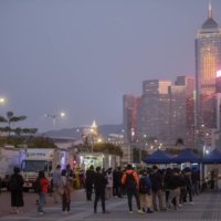 Residents queue for a COVID-19 test in the Central area of Hong Kong, on Friday, Jan. 7. Hong Kong\'s push to reimpose strict COVID-19 control measures suffered an embarrassing setback after it emerged that several government officials had gone to a large party attended by a person believed to be infected. | BLOOMBERG