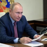 Russia\'s President Vladimir Putin chairs a meeting with Italian businessmen via a video conference at the Novo-Ogaryovo residence outside Moscow, on Wednesday. | AFP-JIJI