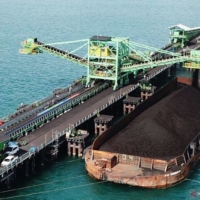 A ship is loaded with coal in Indonesia late last year.  | ANTARA NEWS / VIA KYODO 