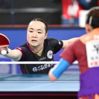 Mima Ito hits a shot against Hina Hayato during the women\'s final at the national table tennis championships on Sunday. | KYODO
