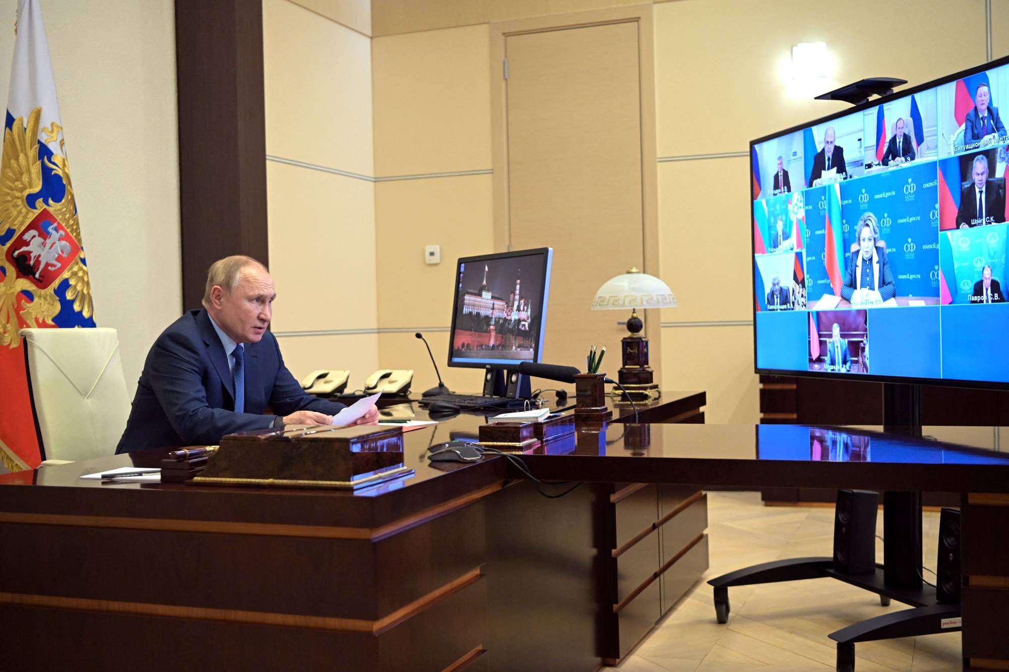 Russian President Vladimir Putin chairs a meeting with members of the Security Council via video link at the Novo-Ogaryovo state residence outside Moscow on Saturday. | REUTERS 