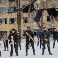 A veteran of the Ukrainian National Guard Azov battalion conducts military exercises for civilians in Kyiv on Sunday as the threat of Russian invasion lingers. | REUTERS