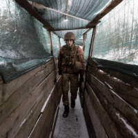 A Ukrainian soldier walks in a trench in Marinka, Ukraine, Thursday, Jan. 27. | TYLER HICKS / THE NEW YORK TIMES