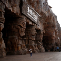 A woman walks at a theme park on the man-made Ocean Flower Island, a resort developed by China Evergrande Group, in Danzhou, Hainan province, China, on Jan. 7. | REUTERS