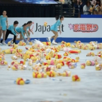 \"Winnie the Pooh\" toys sit on the ice after Yuzuru Hanyu\'s free skate during the 2019 world championships in Saitama on March 23, 2019. | DAN ORLOWITZ