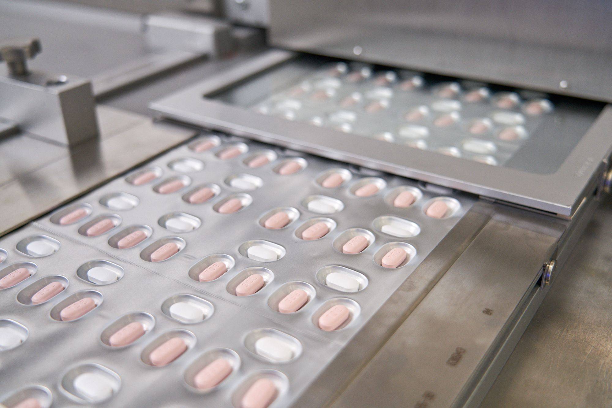 This handout file photo provided on Nov. 16, 2021, courtesy of Pfizer, shows the making of its COVID-19 antiviral pills, Paxlovid, in Freiburg, Germany.  | AFP-JIJI