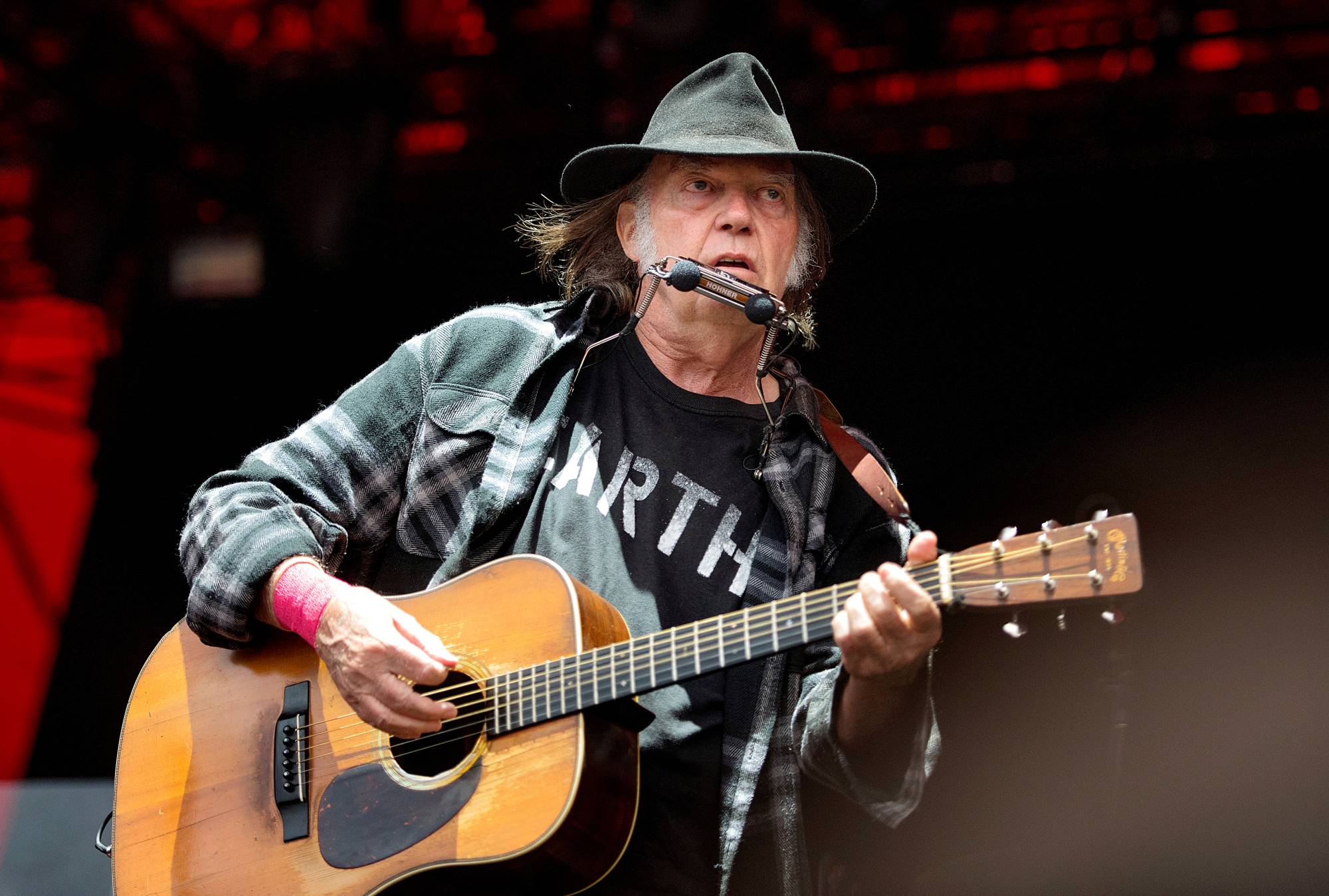 Some see both Neil Young and Joe Rogan as heroes for taking a stand in connection to the Spotify issue — yet their records on the positions they are championing are far from pristine. |  REUTERS 