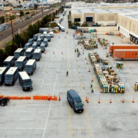 Amazon delivery vans leave a shipping facility in Rosemead, California, on Jan. 13. | ROGER KISBY / THE NEW YORK TIMES