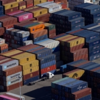 Shipping containers at the port of Oakland, California, in October | REUTERS