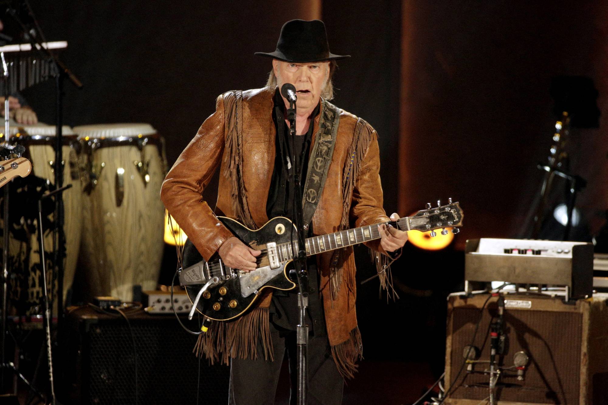 Singer and songwriter Neil Young performs in Washington in November 2015. | REUTERS