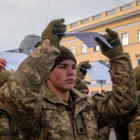 Ukrainian soldiers attend a rally in Odessa, Ukraine, on Jan. 22. | BLOOMBERG 