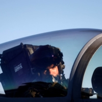 A pilot operates onboard the aircraft carrier USS Harry S. Truman in the Adriatic Sea on Wednesday. | REUTERS