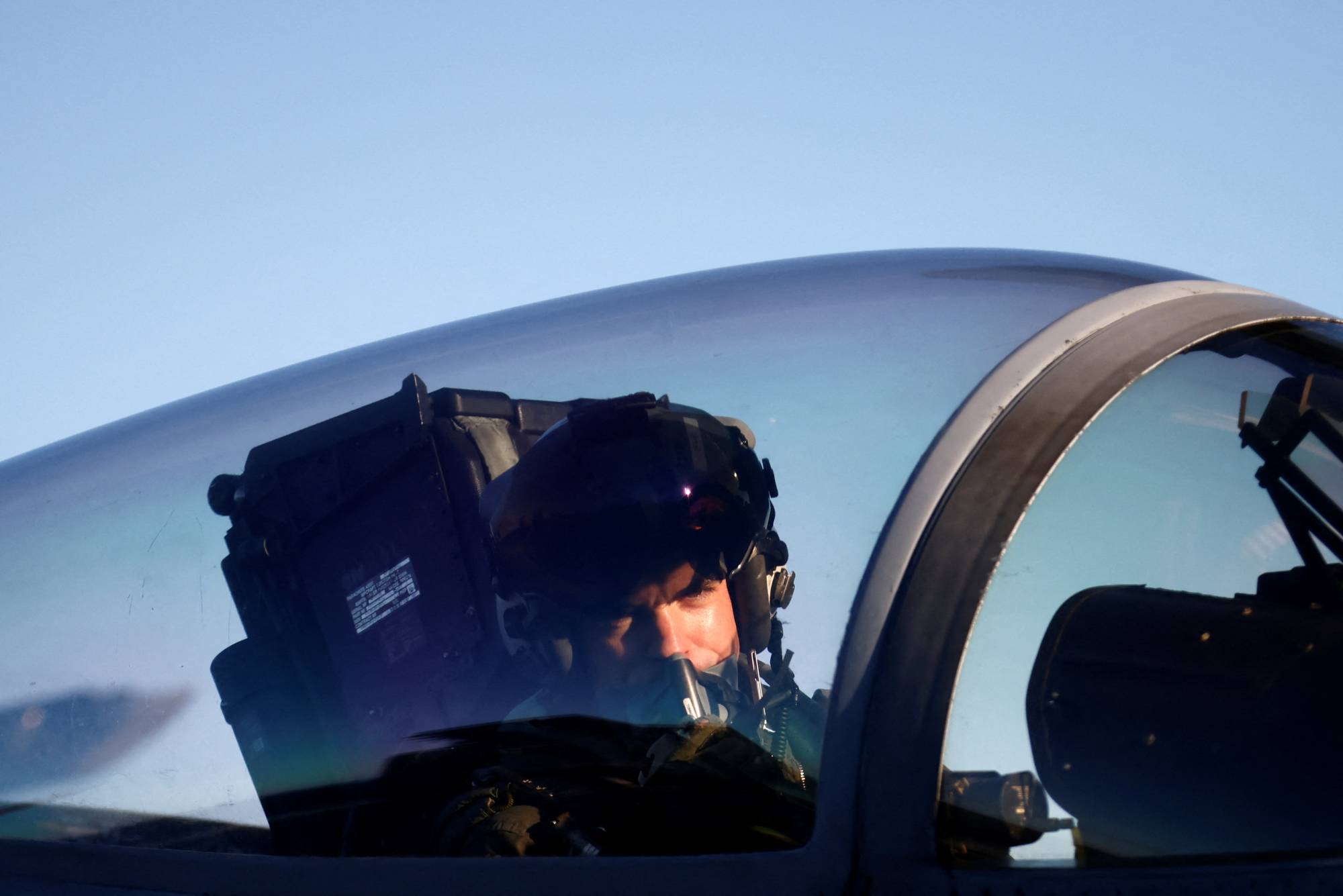 A pilot operates onboard the aircraft carrier USS Harry S. Truman in the Adriatic Sea on Wednesday. | REUTERS