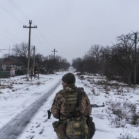 Soldiers with Ukrainian Army’s 53rd Mechanized Brigade walk from a front line position in Novotroitske, Ukraine, on Wednesday. | BRENDAN HOFFMAN / THE NEW YORK TIMES