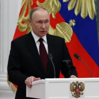 Russian President Vladimir Putin speaks during a ceremony to present the highest state awards at the Kremlin in Moscow on Wednesday. | POOL / SPUTNIK / VIA REUTERS