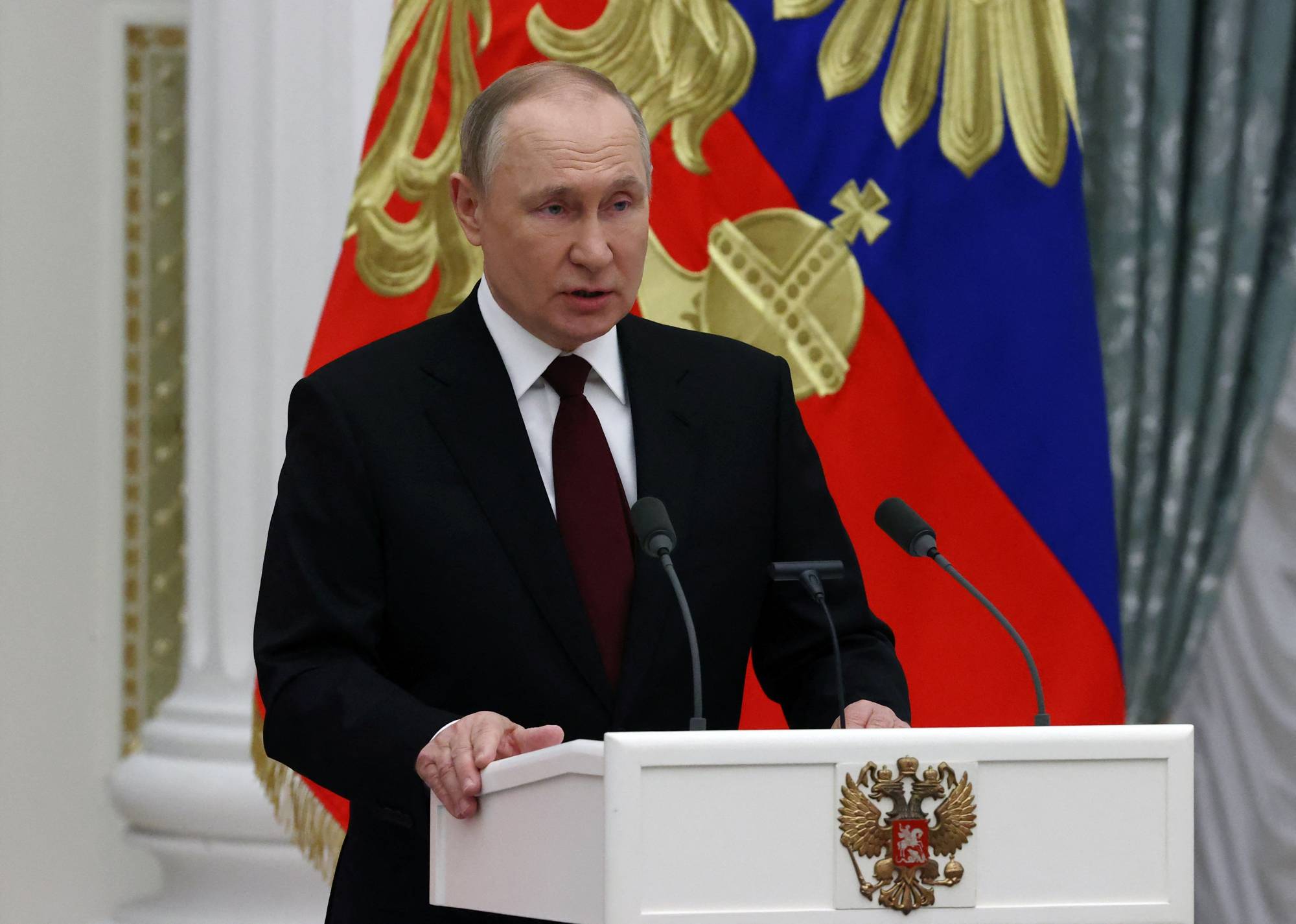 Russian President Vladimir Putin speaks during a ceremony to present the highest state awards at the Kremlin in Moscow on Wednesday. | Pool / Sputnik / via REUTERS
