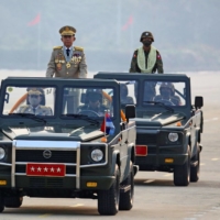 Myanmar\'s junta chief, Gen. Min Aung Hlaing, who ousted the elected government in a coup in early  February last year, presides a parade on Armed Forces Day in Naypyitaw in March.  | REUTERS