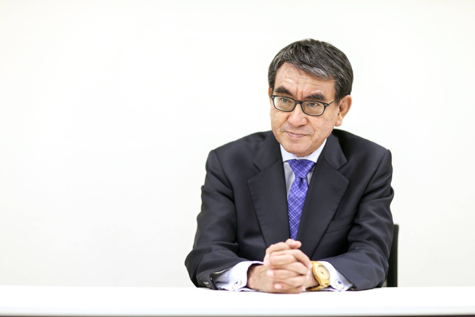 Taro Kono, former vaccine minister, says he hopes Japan's strict border curbs against coronavirus can be eased from March. | Bloomberg