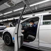 Hyundai Motor Co.\'s Ioniq 5 at its plant in Ulsan, South Korea. In Japan, where electric vehicles haven’t managed to reach a 1% market share, it’s difficult to gauge whether consumers will embrace the compact sports utility vehicle. | BLOOMBERG