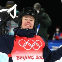 Walter Wallberg of Sweden celebrates after winning gold in the men\'s moguls at the 2022 Beijing Olympics. | REUTERS
