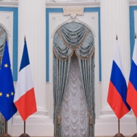 Russian President Vladimir Putin and French President Emmanuel Macron attend a joint press conference after meeting in Moscow on Tuesday. | AFP-JIJI