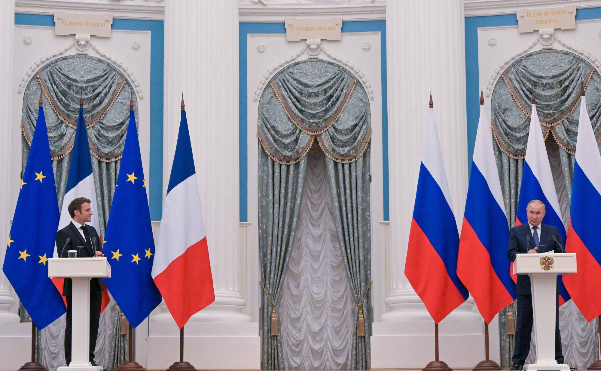 Russian President Vladimir Putin and French President Emmanuel Macron attend a joint press conference after meeting in Moscow on Tuesday. | AFP-JIJI
