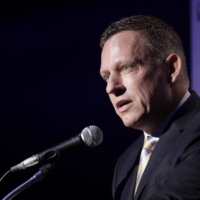 Peter Thiel, co-founder and chairman of Palantir Technologies Inc., speaks during a news conference in Tokyo in 2019. The billionaire entrepreneur was in Japan to unveil a $150 million, 50-50 joint venture with local financial services firm Sompo Holdings Inc. Palantir Technologies Japan Co. will target government and public sector customers, initially emphasizing health and cybersecurity. | BLOOMBERG