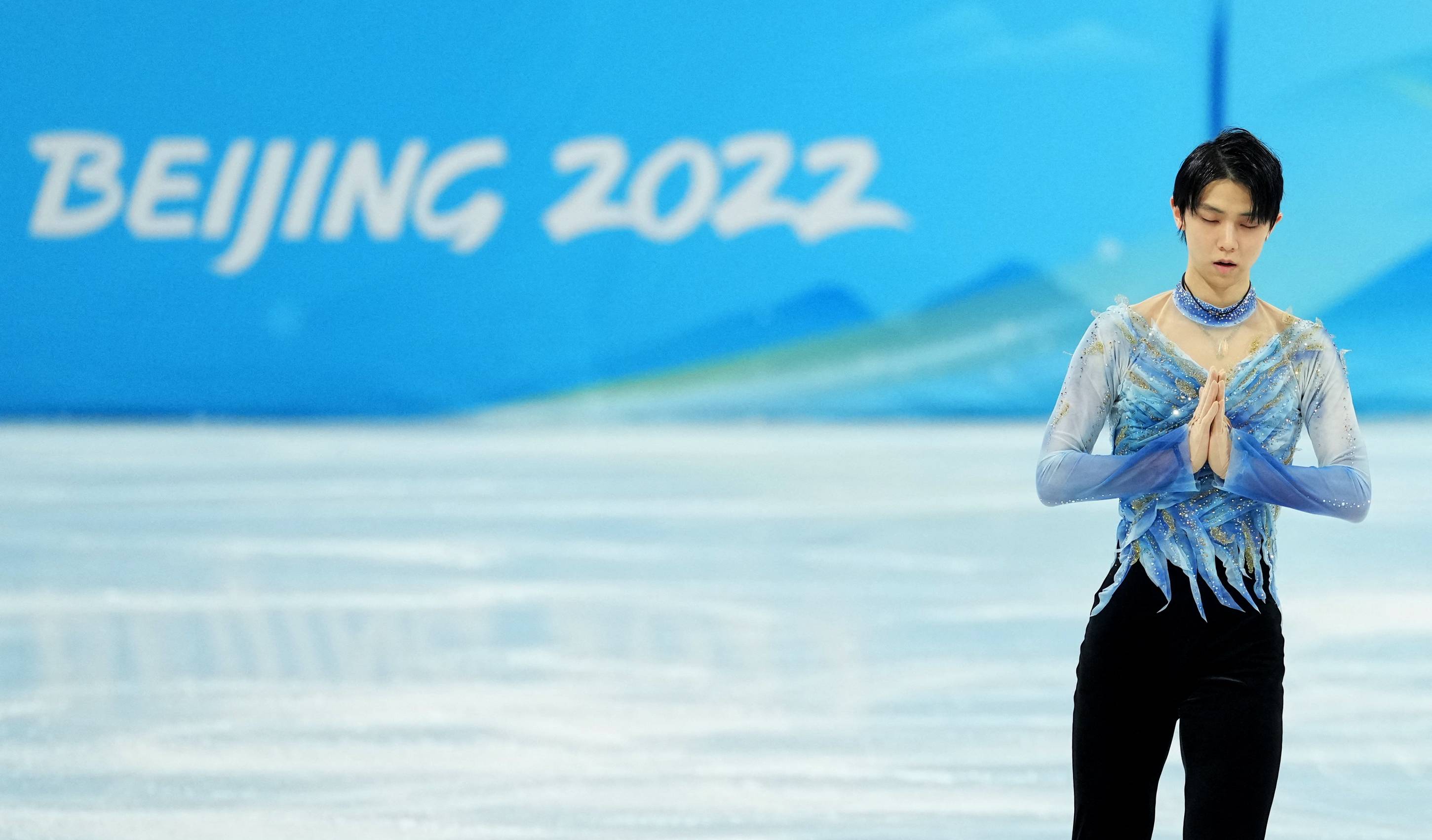 Yuzuru Hanyu of Japan reacts after his performance in the short program portion of the men's single skating event at the 2022 Winter Olympics in Beijing on Tuesday. | REUTERS