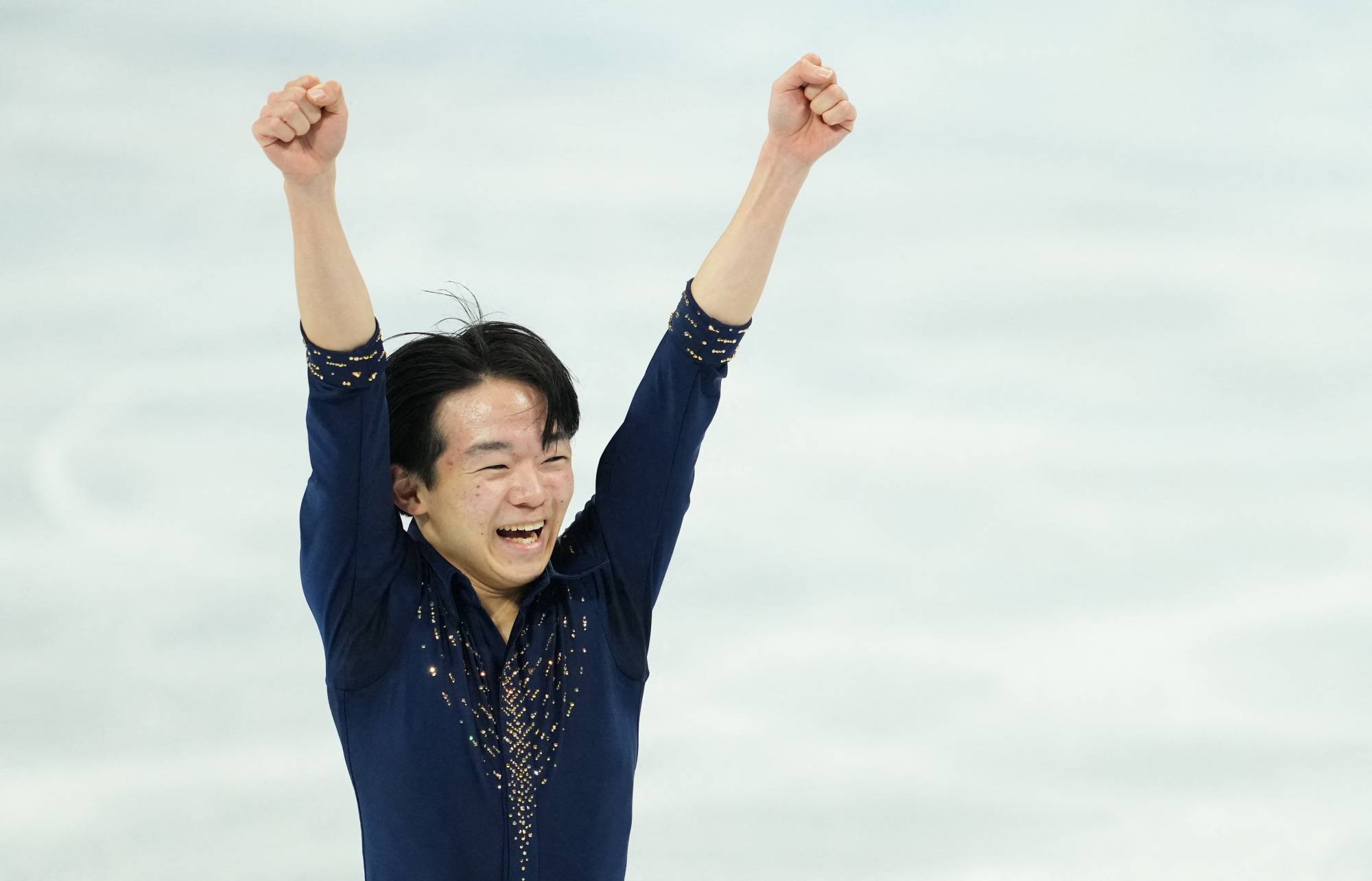 Yuma Kagiyama of Japan reacts after his performance in the short program portion of the men's single skating event at the 2022 Winter Olympics in Beijing on Tuesday. | REUTERS