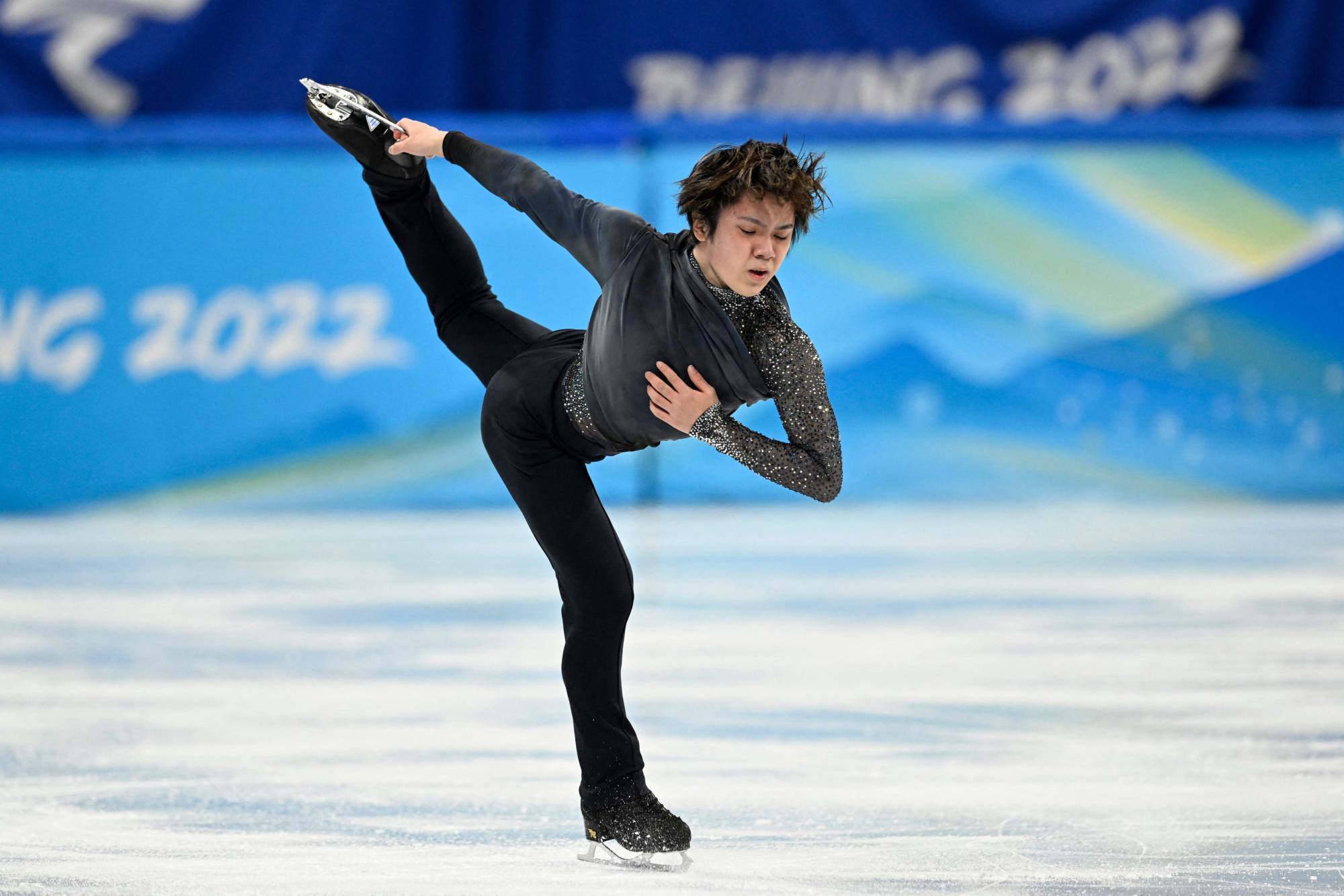 Japan's Shoma Uno competes in the men's single skating short program of the figure skating event during the 2022 Winter Olympic Games at the Capital Indoor Stadium in Beijing on Tuesday. | AFP-JIJI