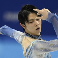 Yuzuru Hanyu of Japan competes in the men\'s single skating short program during the Beijing Winter Olympic Games at the Capital Indoor Stadium on February 8, 2022. | AFP-JIJI
