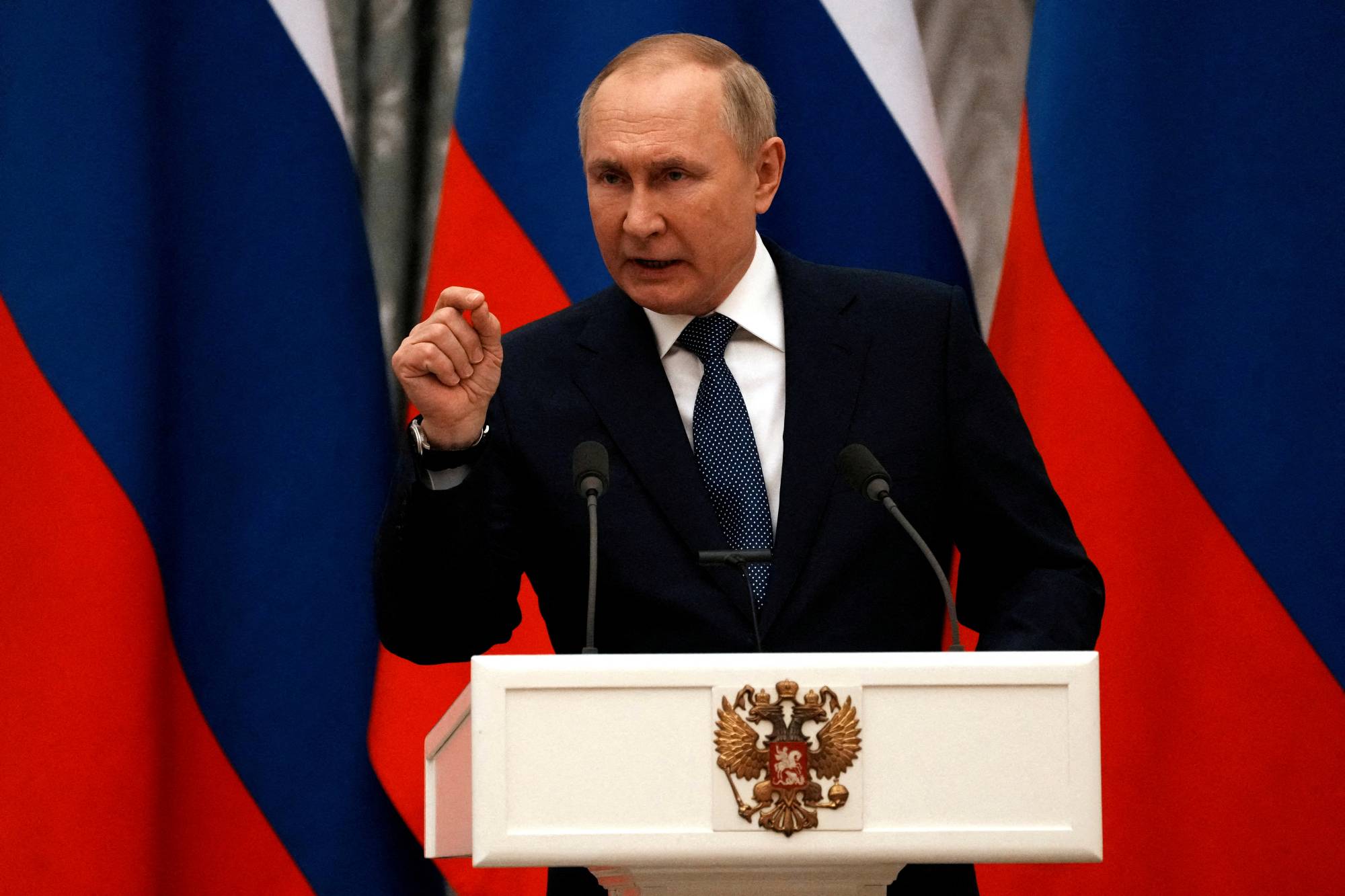 Russian President Vladimir Putin during a news conference in Moscow on Monday | Pool / via Reuters 