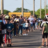 Children queue to be inoculated against COVID-19 with doses of the CoronaVac vaccine during a vaccination campaign in San Lorenzo, Paraguay, on Jan. 31. | AFP-JIJI